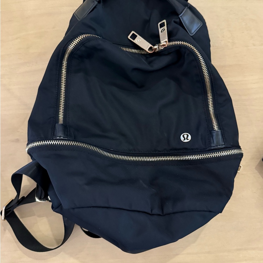 lululemon athletica Black Backpack with GOLD color Accents city adventure EUC